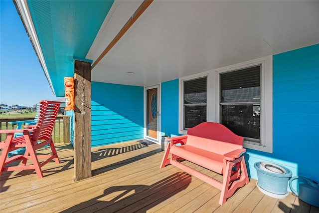 wooden deck featuring covered porch