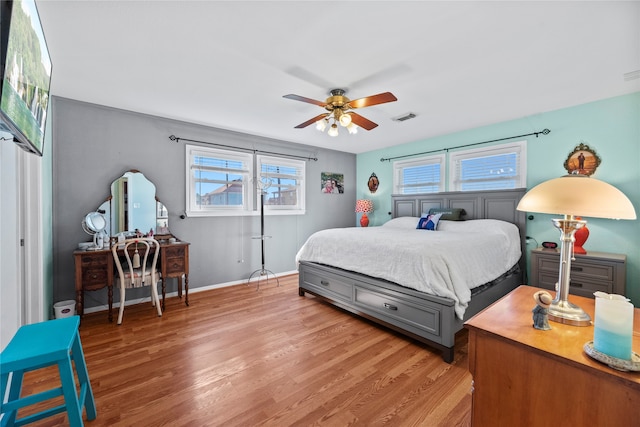 bedroom with hardwood / wood-style flooring and ceiling fan