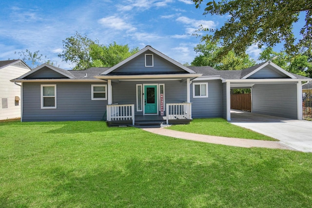 single story home featuring an attached carport, a porch, a front yard, roof with shingles, and driveway