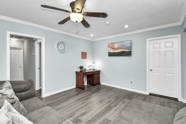 living room with hardwood / wood-style flooring, a textured ceiling, crown molding, and ceiling fan