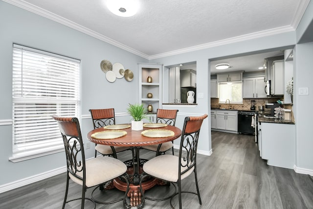 dining space with sink, a textured ceiling, dark hardwood / wood-style floors, and crown molding