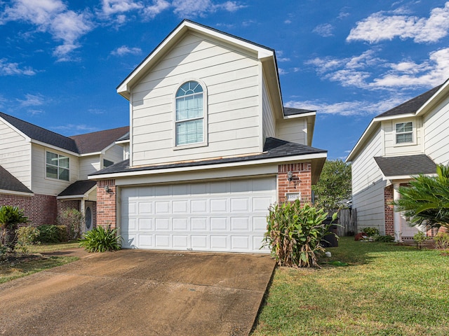 front of property with a garage and a front yard