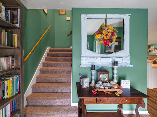 stairs featuring wood-type flooring