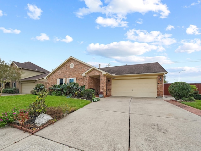 single story home with a garage and a front lawn