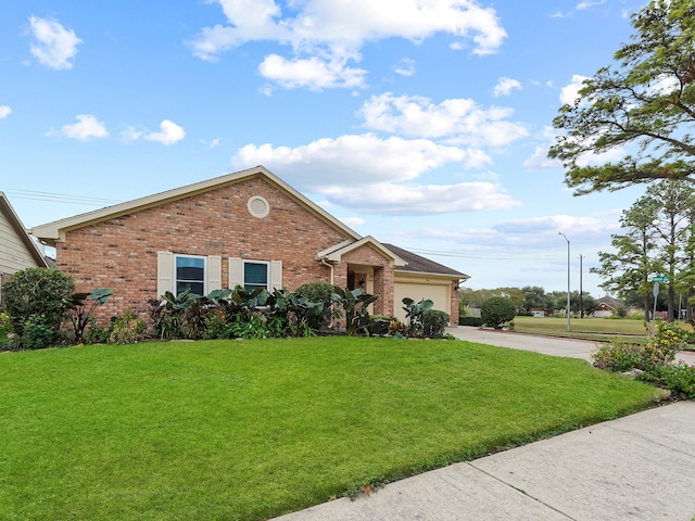 view of front facade with a garage and a front yard