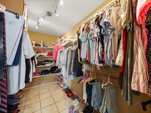 spacious closet featuring light tile patterned floors