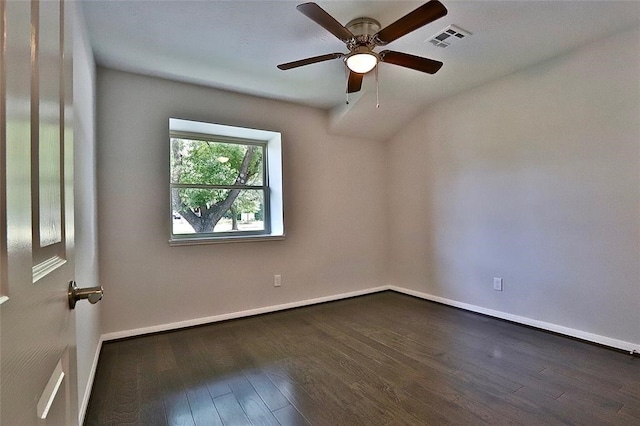 unfurnished room with dark wood-type flooring, ceiling fan, and vaulted ceiling