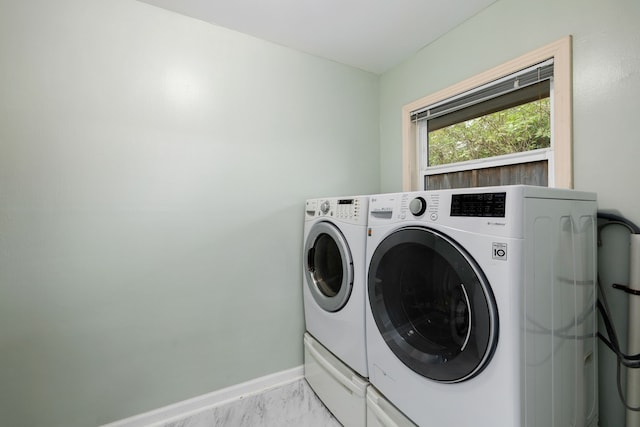 laundry area featuring washing machine and clothes dryer