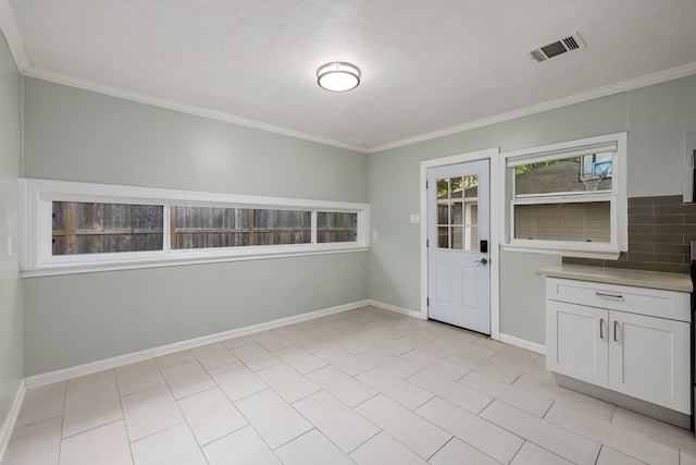 interior space featuring crown molding