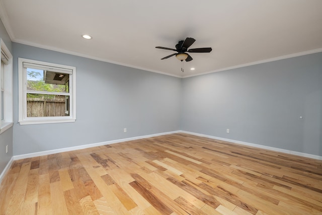 spare room featuring crown molding, light hardwood / wood-style flooring, and ceiling fan