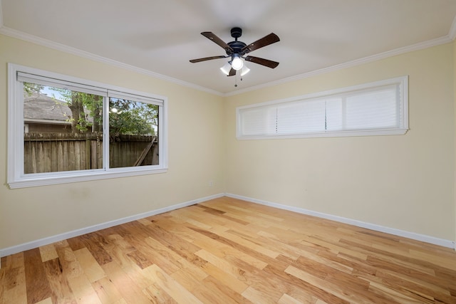 unfurnished room with crown molding, ceiling fan, and light wood-type flooring