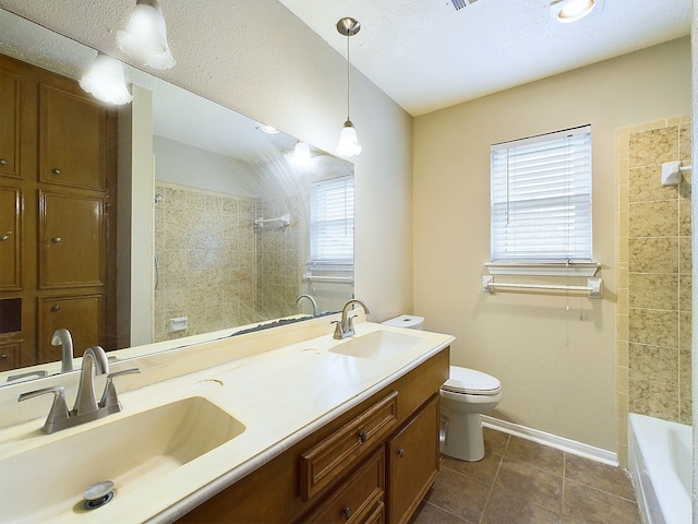 full bathroom featuring toilet, vanity, tile patterned flooring, and plenty of natural light