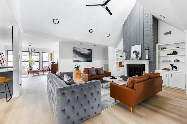 living room with a fireplace, high vaulted ceiling, light hardwood / wood-style flooring, and ceiling fan