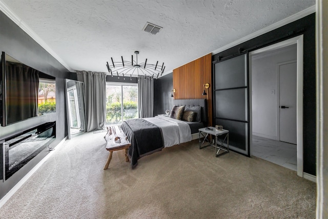 carpeted bedroom featuring crown molding and a textured ceiling