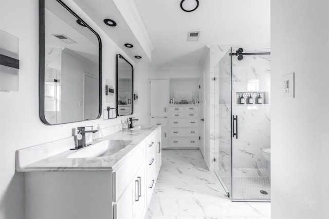 bathroom featuring vanity, crown molding, and walk in shower