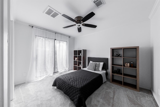 bedroom featuring ceiling fan, crown molding, and carpet