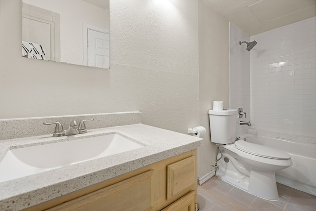 full bathroom with tile patterned floors, vanity, toilet, and tiled shower / bath