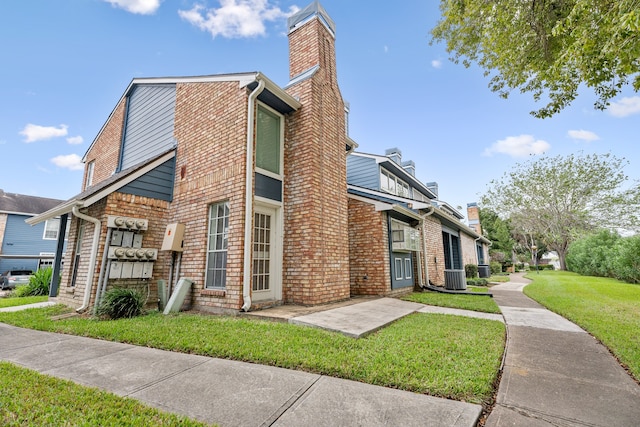 view of property exterior with a yard