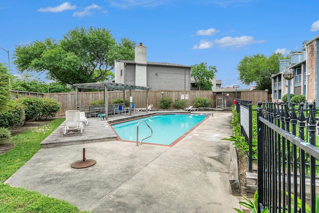 view of swimming pool with a patio area