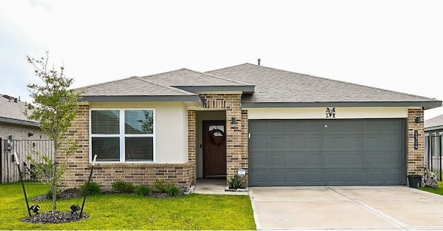 view of front of house with a garage and a front yard