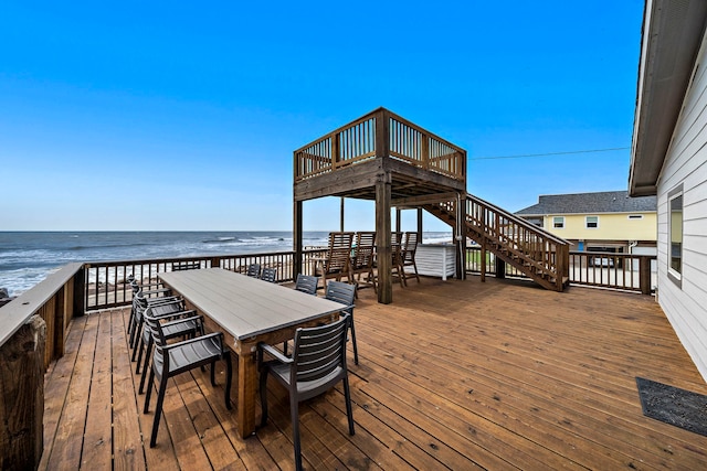 wooden terrace with a beach view and a water view