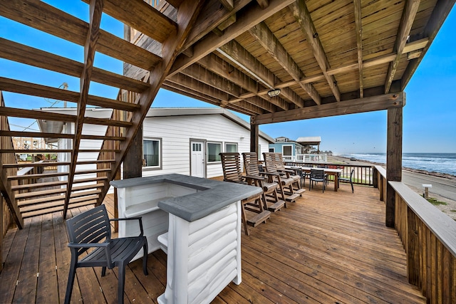 wooden deck with a water view