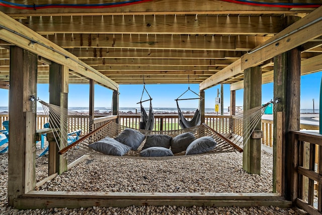 wooden terrace with a water view