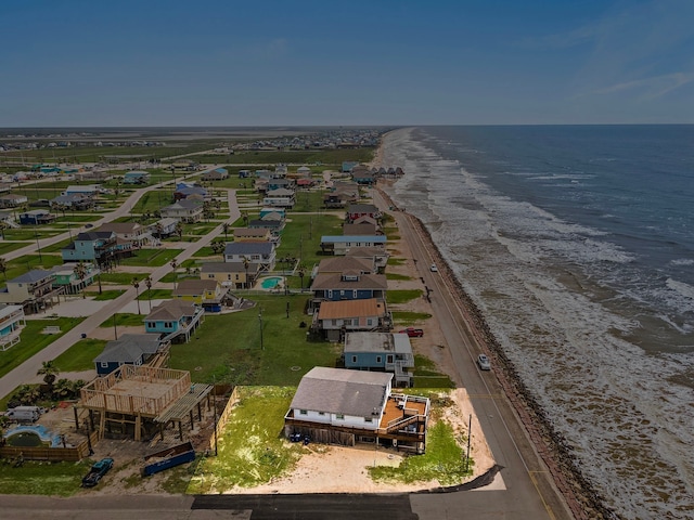 birds eye view of property featuring a view of the beach and a water view