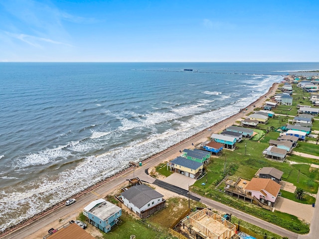 bird's eye view featuring a view of the beach and a water view