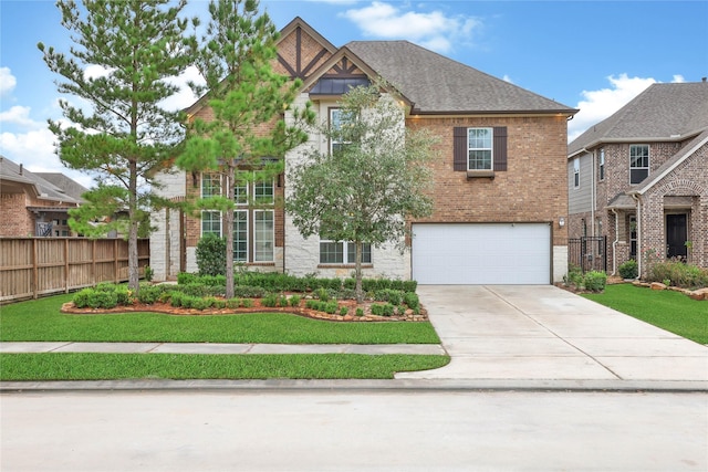 view of front facade with a garage and a front lawn