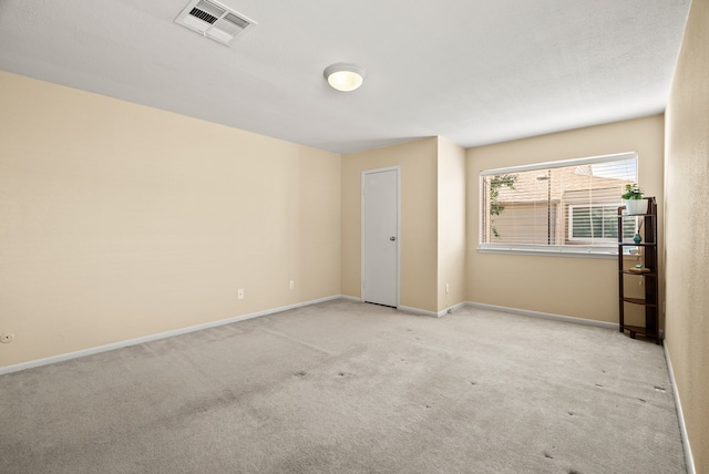 unfurnished bedroom featuring light carpet