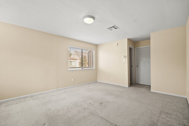 empty room with light colored carpet