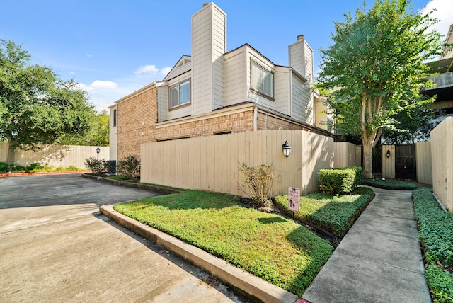 view of home's exterior with a yard