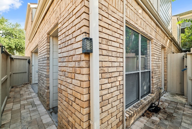 view of side of home with a patio