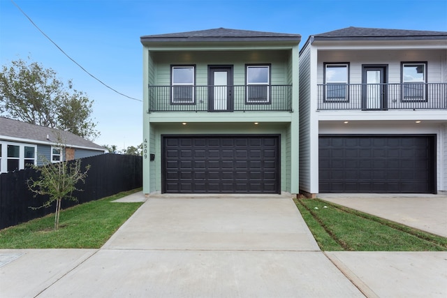 view of front of property with a balcony and a garage