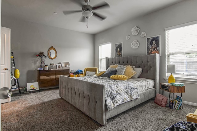 carpeted bedroom with multiple windows and ceiling fan