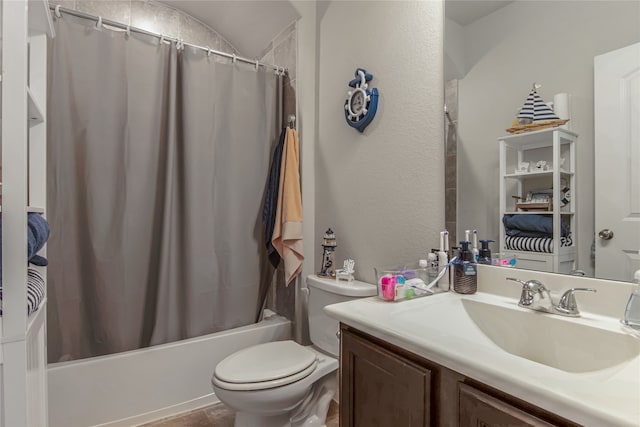 full bathroom with shower / tub combo with curtain, vanity, and toilet