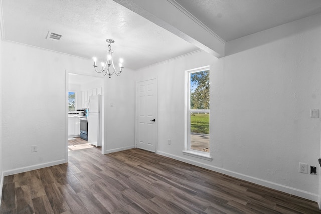 unfurnished dining area with a chandelier, crown molding, and dark wood-type flooring