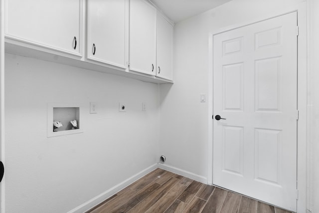 laundry area featuring cabinets, hookup for a washing machine, dark hardwood / wood-style floors, and hookup for an electric dryer