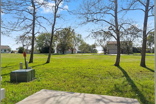 view of yard with a garage