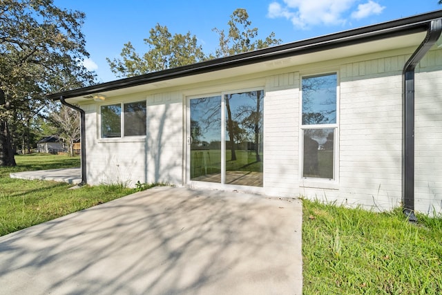 view of property exterior with a patio