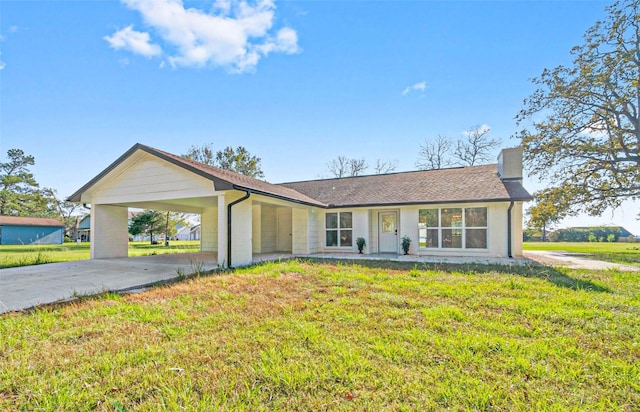 ranch-style house with a front lawn and a carport