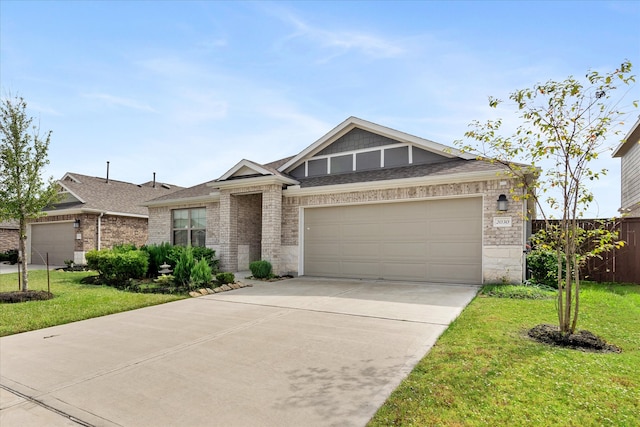 view of front of house featuring a garage and a front yard