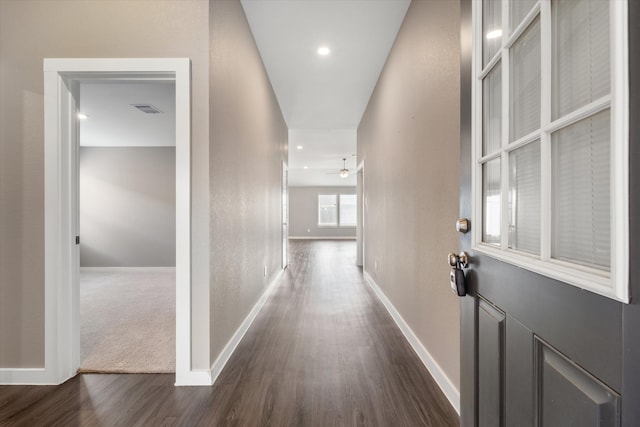 corridor featuring dark hardwood / wood-style flooring