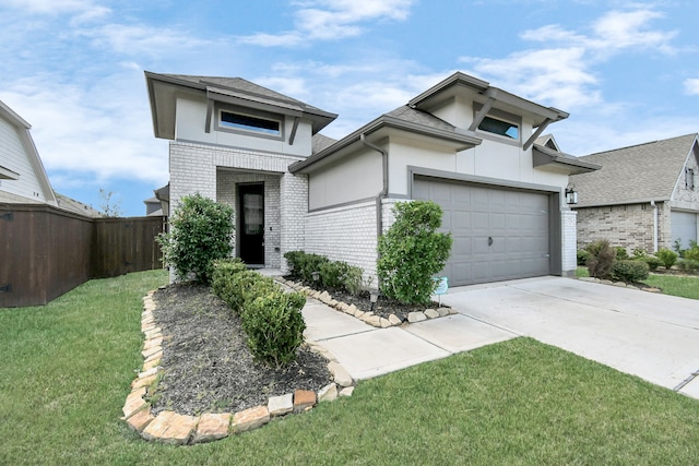 prairie-style house with a front lawn and a garage