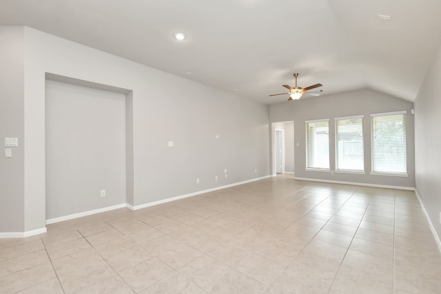 unfurnished room with light tile patterned flooring, lofted ceiling, and ceiling fan