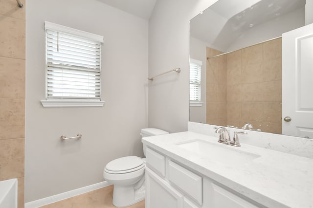 full bathroom with vanity, toilet, and tiled shower / bath