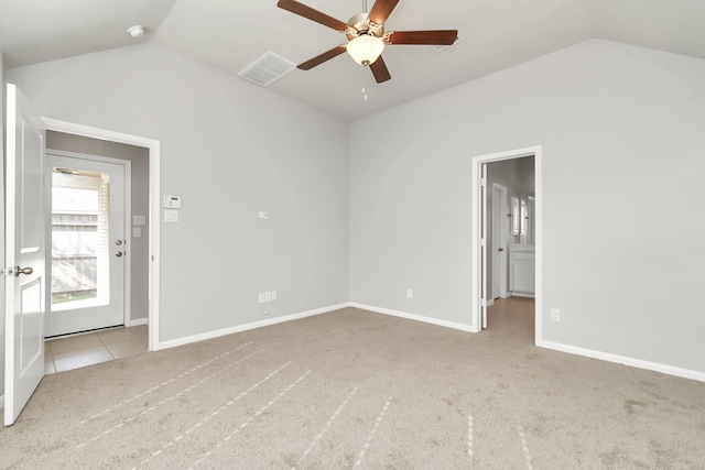 unfurnished room with light colored carpet, lofted ceiling, and ceiling fan