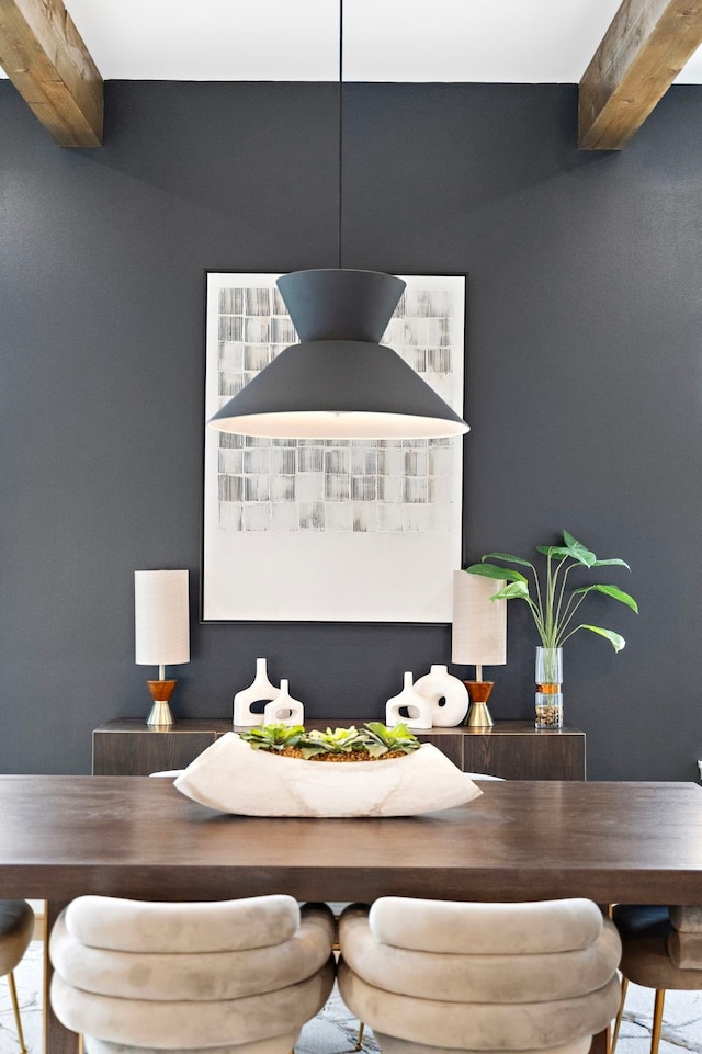 dining area with beamed ceiling