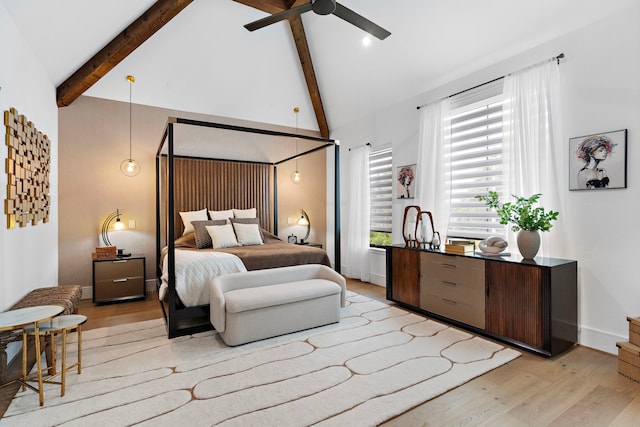 bedroom with beamed ceiling, high vaulted ceiling, and light hardwood / wood-style floors